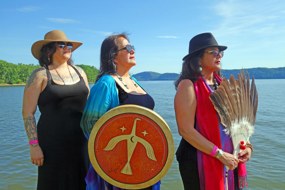 Joanne Shenandoah (right) with her daughter Leah Shenandoah (left) and her sister Diane Schenandoah (center) near the Hudson River during the Clearwater Festival in Croton-on-Hudson, N.Y. in 2019.