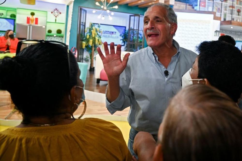 Tegucigalpa's mayor and presidential candidate for the ruling National Party Nasry Asfura gestures as he takes part in a TV show on Friday.
