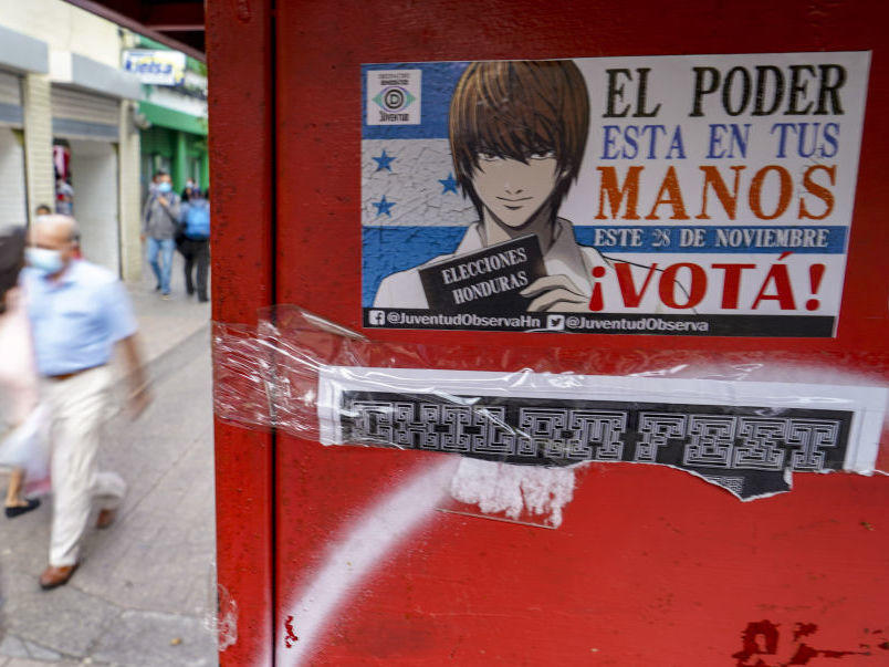 A sticker on a wall in Tegucigalpa, the Honduran capital, invites people to vote in the presidential elections on Sunday. Hondurans will elect a successor to President Juan Orlando Hernandez, who was first elected in 2013.