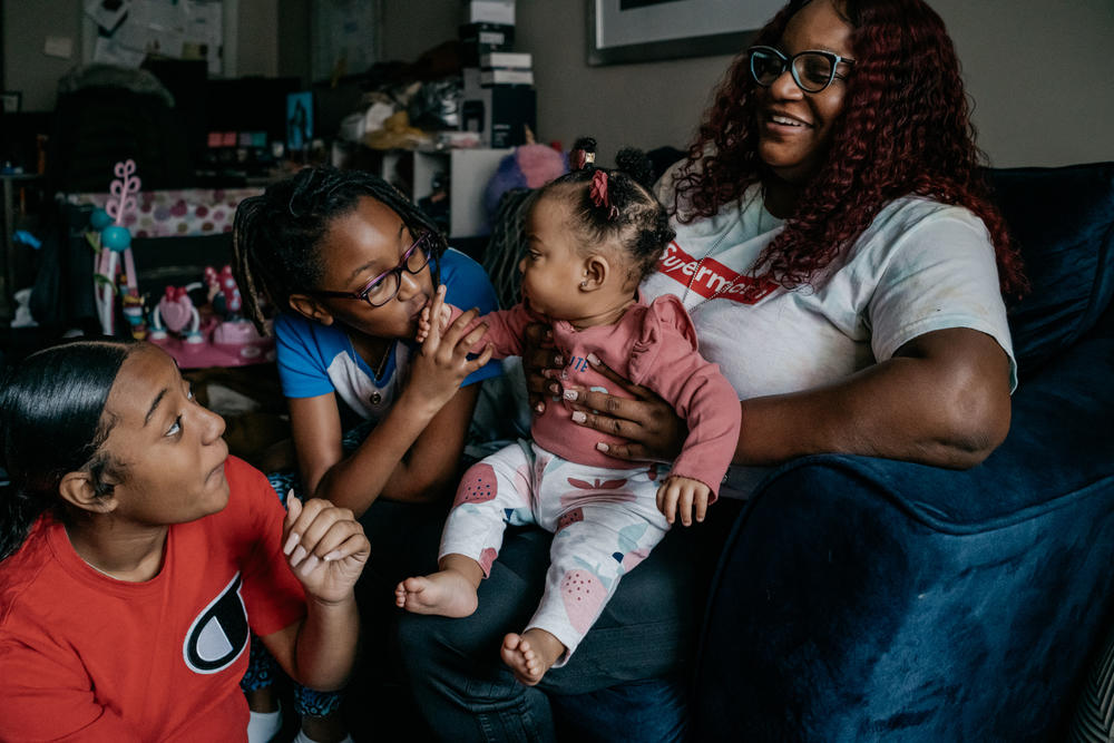 Cassie Washington at home with her three daughters, Cali, Cayden and Chloe. After fleeing her marriage in 2015, Washington and her older children started attending therapy sessions to work through their experience together.