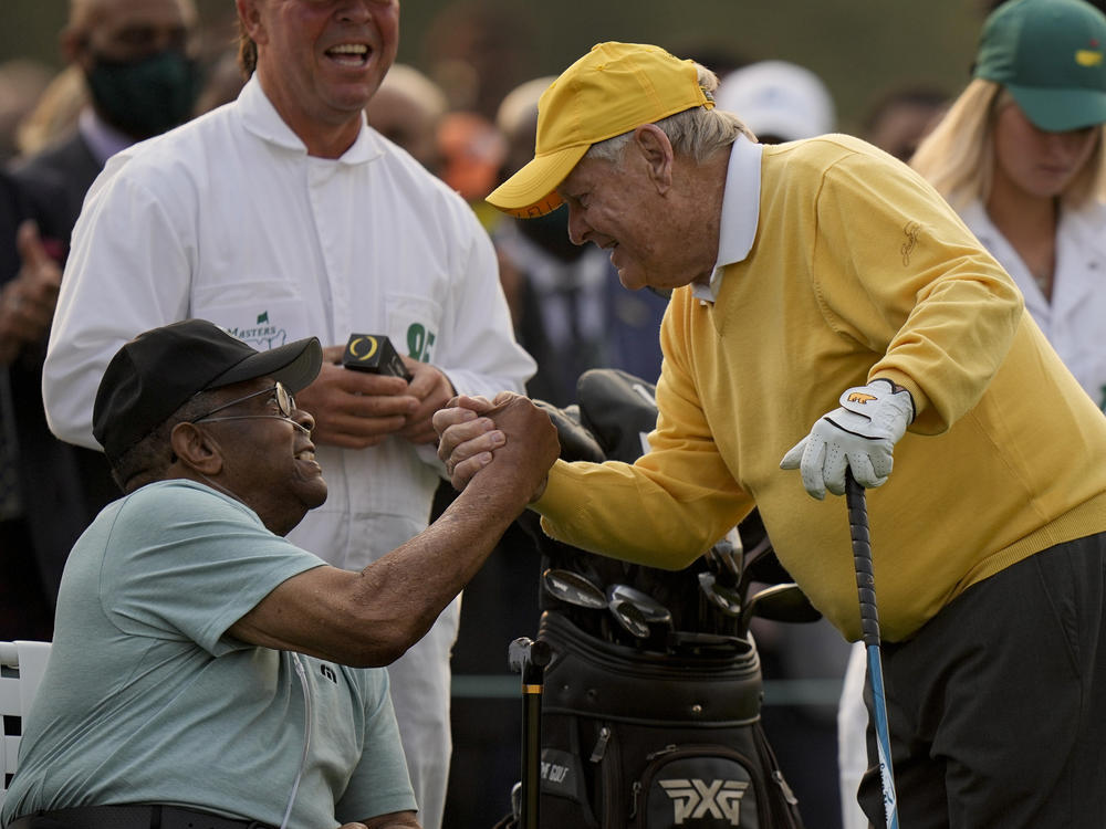 Jack Nicklaus shakes hands with Lee Elder after hitting the ceremonial first tee during the first round of the Masters golf tournament on April 8 in Augusta, Ga.