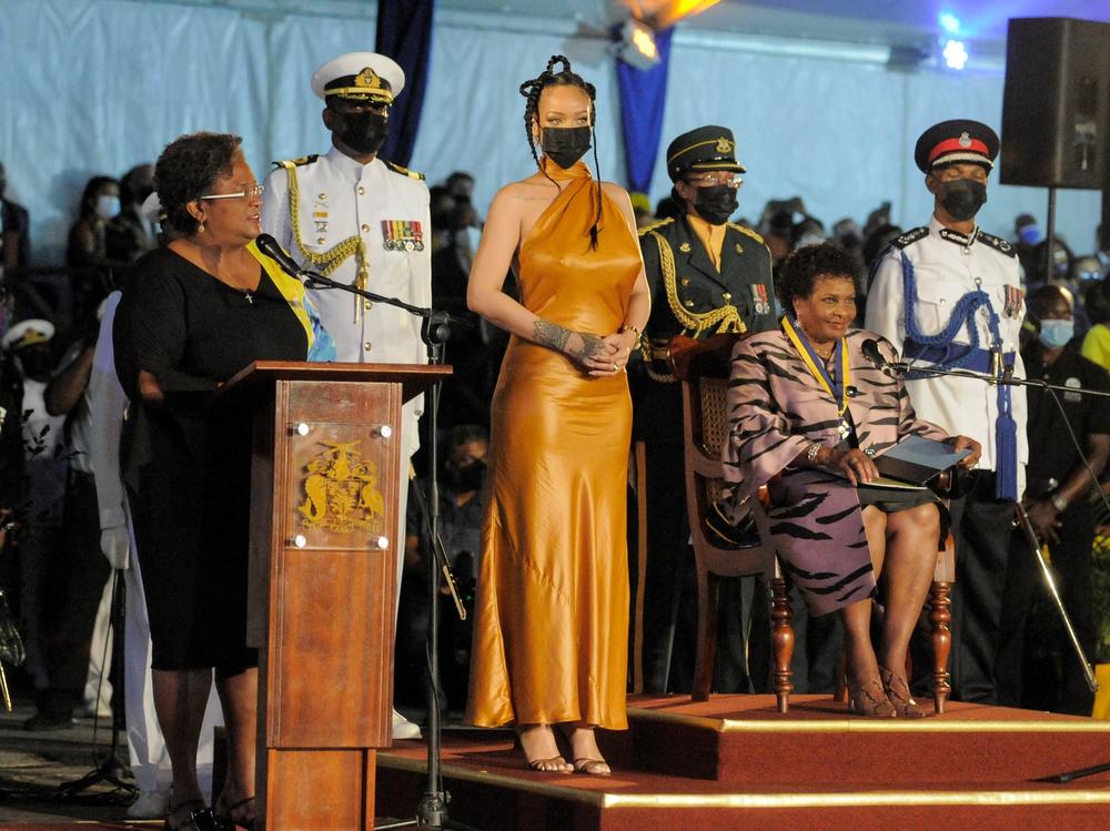 Barbados's Prime Minister Mia Mottley, left, asks the country's new president, Sandra Mason, seated at right, to make Barbadian singer Rihanna the country's 11th National Hero during a ceremony to declare Barbados a republic Tuesday.