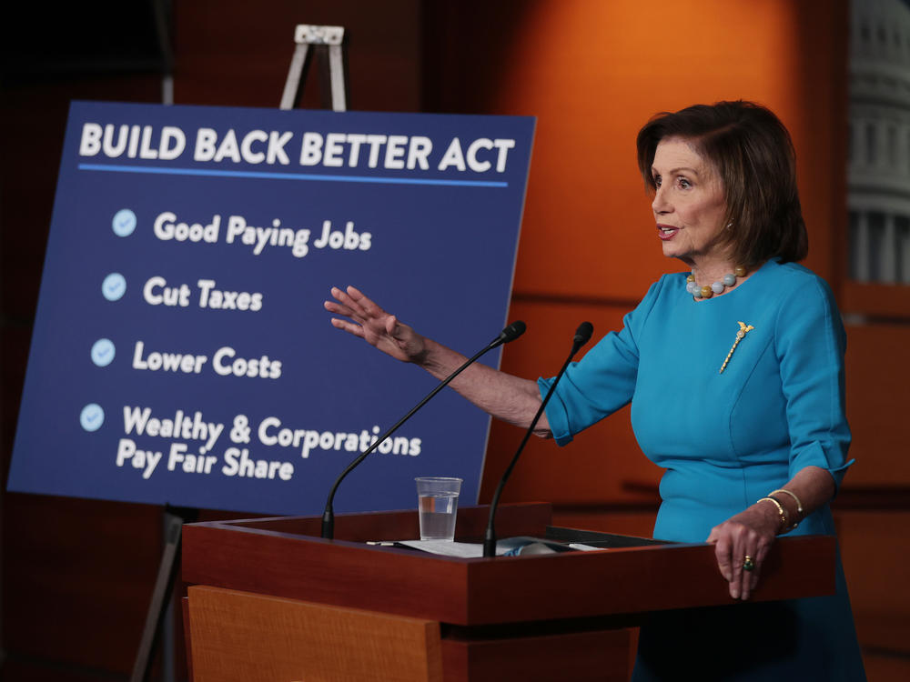 House Speaker Nancy Pelosi, D-Calif., talks to reporters ahead of House passage of Democrats' Build Back Better Act, which now faces changes in the Senate.