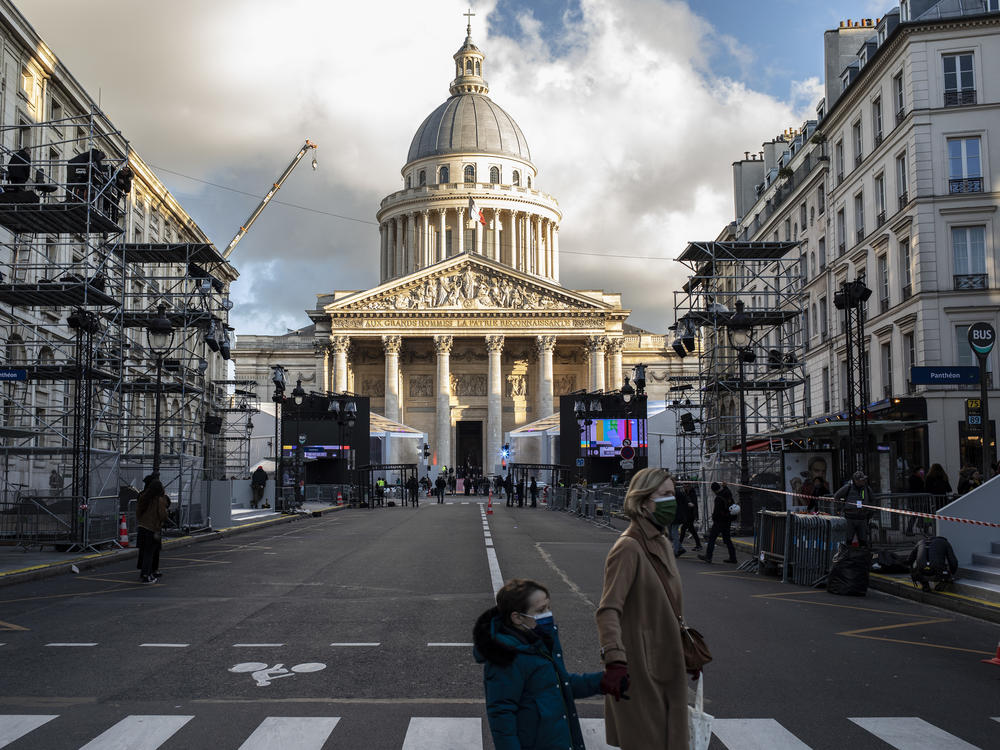 People cross a street close to the Pantheon in Paris. On Tuesday, Josephine Baker becomes the sixth woman to be commemorated in the Pantheon.