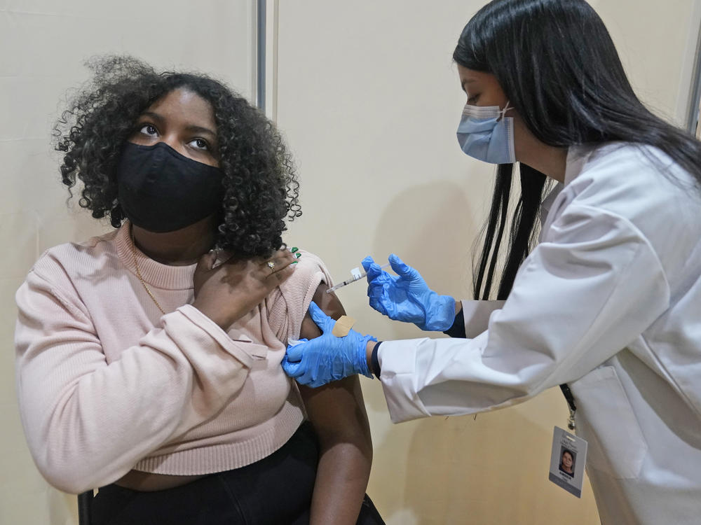 Keidy Ventura, 17, receives her first dose of the Pfizer COVID-19 vaccine in West New York, N.J. Pfizer has asked federal regulators to expand the eligibility for booster shots to include 16- and 17-year-olds.