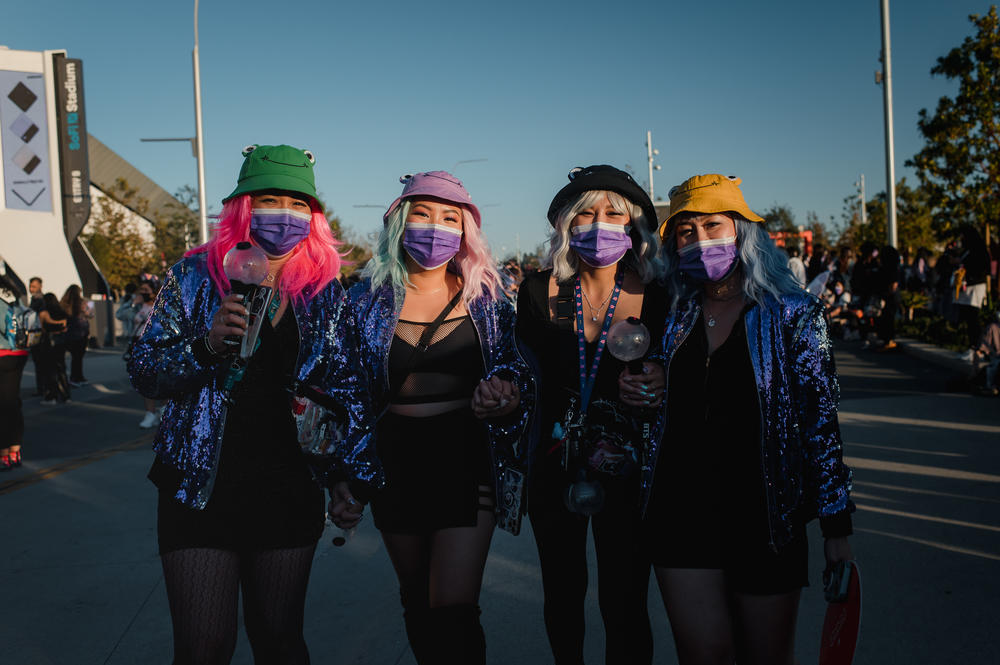 Friends Ravy Sok, Stephanie Tea, Rosemary Millan and Lina Sok walk together outside the SoFi stadium.