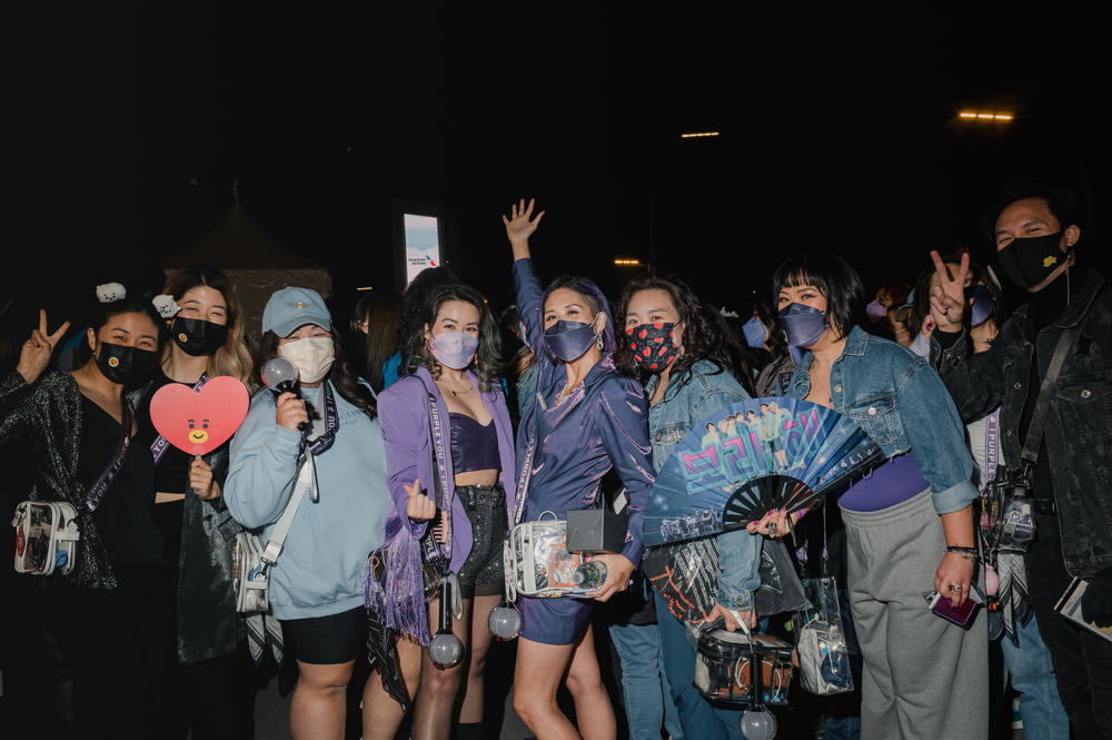 Fans wait in line for the BTS concert at SoFi Stadium in Inglewood.