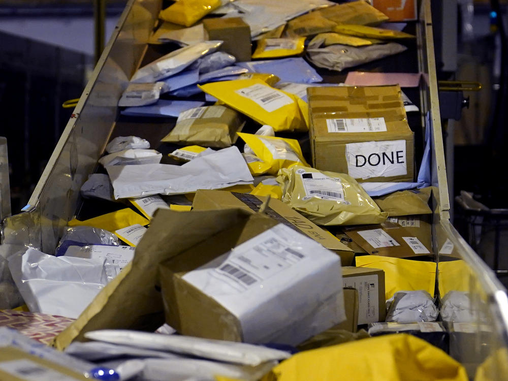 Parcels jam a conveyor belt at the United States Postal Service sorting and processing facility in Boston.