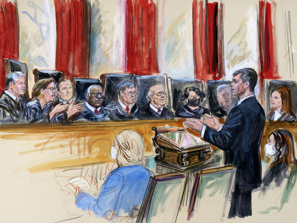 This artist sketch depicts Mississippi Solicitor General Scott Stewart, standing while speaking to the Supreme Court on Wednesday. Center for Reproductive Rights Litigation Director Julie Rikelman is seated right.