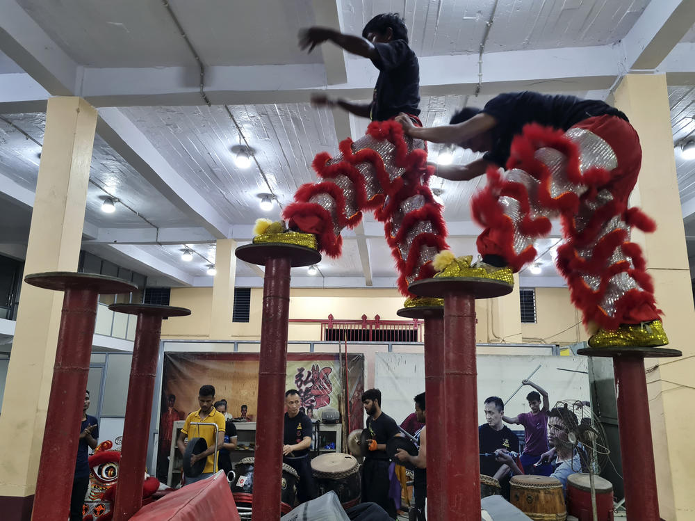 Indian students rehearse a traditional Chinese dragon dance in a warehouse in Kolkata. Their instructor, James Liao, is an Indian of Chinese descent. He says he teaches Chinese martial arts and dance as a way to build bridges between India and China and teach Indians about their diversity.