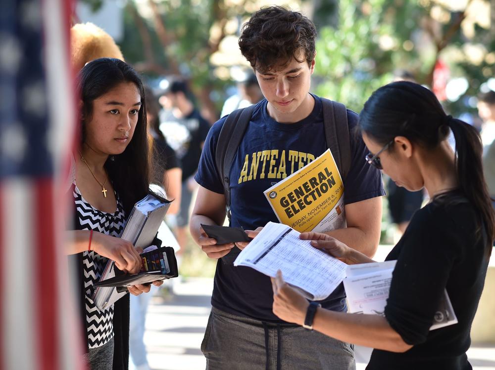 Students wait in line to cast their ballot at a polling station on the campus of the University of California, Irvine, on Nov. 6, 2018.