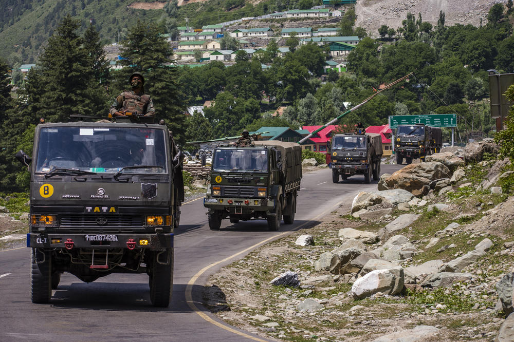 An Indian army convoy drives towards Leh, on a highway bordering China, on June 19, 2020, in Gagangir, India.