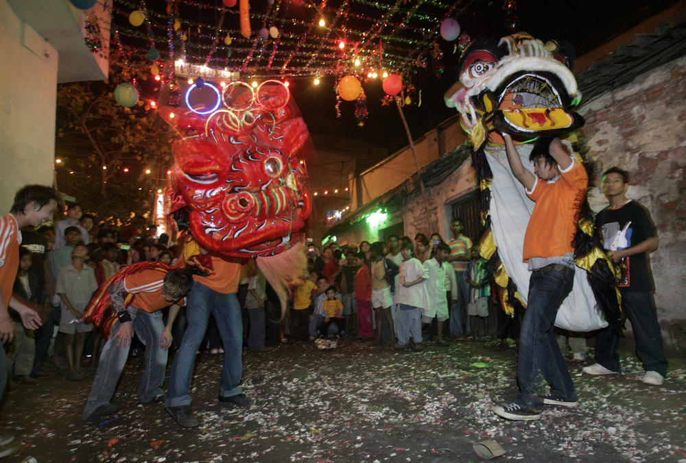 Members of the Chinese community in India perform a dragon dance as they celebrate the Lunar New Year in a Chinatown in Kolkata in 2008.
