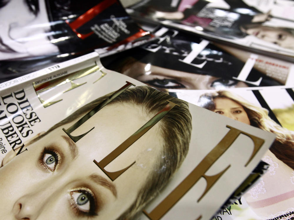 A file picture taken in January 2011 in Paris shows covers of some of the 42 foreign editions of the French fashion magazine 
