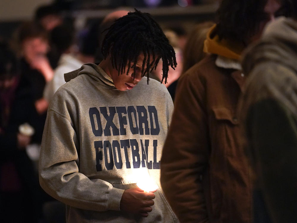 Joshua McDade, a former student at Oxford High School, attends a vigil at LakePoint Community Church in Oxford, Mich., on Tuesday.