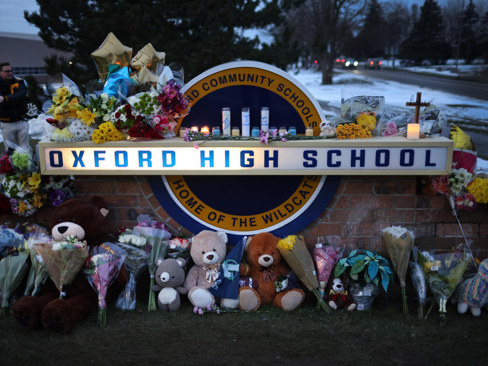 A makeshift memorial seen outside Oxford High School in Oxford, Mich., on Wednesday honors the four students who were fatally shot and seven people who were injured.