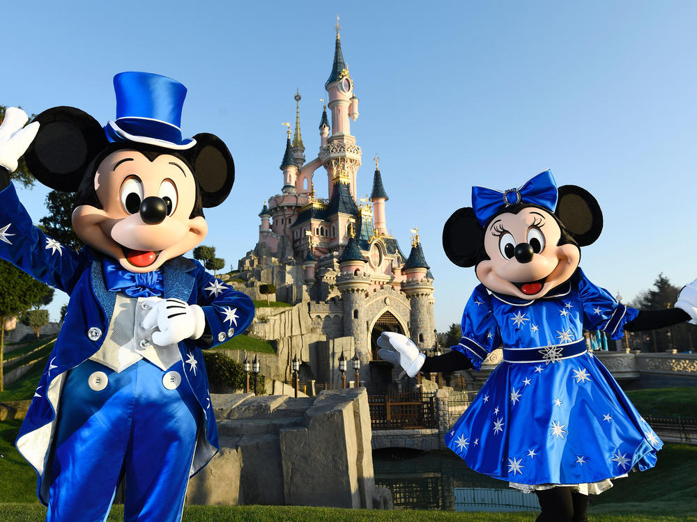 Mickey and Minnie in front of the Sleeping Beauty Castle, marking the 25th anniversary of Disneyland - originally Euro Disney Resort.