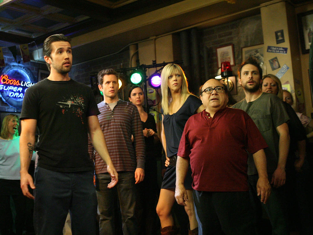 Actors Rob McElhenney, Glenn Howerton, Kaitlin Olson, Danny DeVito and Charlie Day act during a dance scene on the set of 
