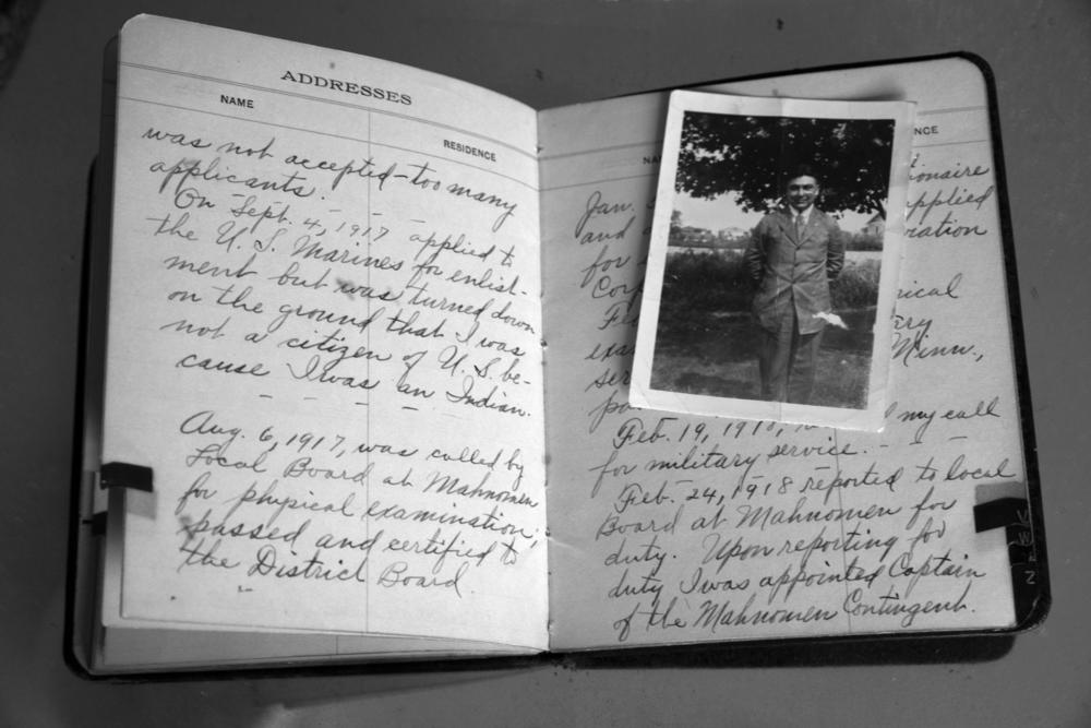 An excerpt from a journal entry that was found in John B. McGillis's address book conveyed his process for enlisting in WWI. He first applied for enlistment with the U.S. Marines but was denied on the ground that he was Native American and did not have U.S. citizenship. He was later called for military service in WWI, and was appointed Captain of the Mahnomen Contingent.