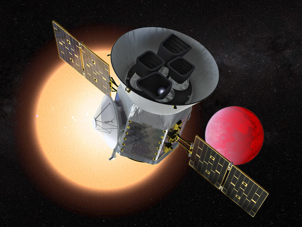 The planet-hunting telescope TESS depicted in front of a lava world orbiting a small red star.