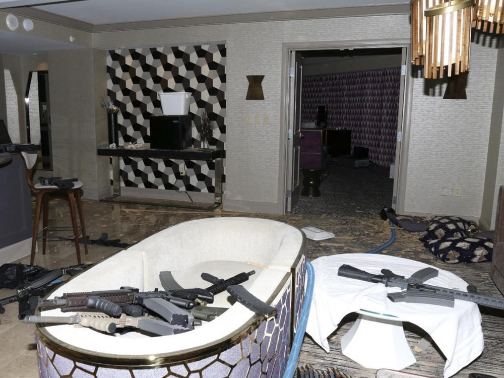 An October 2017 file photo released by the Las Vegas Metropolitan Police Department Force Investigation Team Report shows a number of guns in the interior of mass shooter Stephen Paddock's 32nd floor room of the Mandalay Bay hotel in Las Vegas.