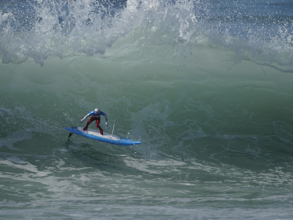 A remote-controlled RC surfer riding a king tide wave during the astronomical event last year, in Huntington Beach, Calif. The National Weather Service says the California coast will see unusually high and low tides over the weekend.