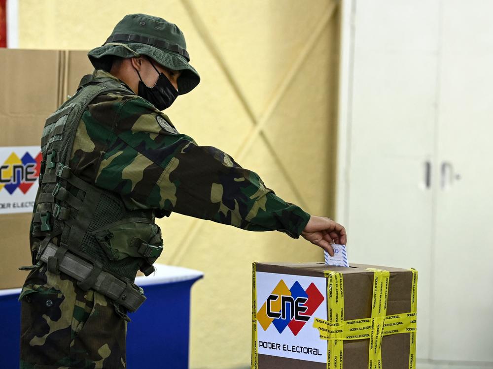 A member of the Bolivarian National Guard votes at a polling station during regional and municipal elections in Fort Tiuna in Caracas, on Nov. 21.