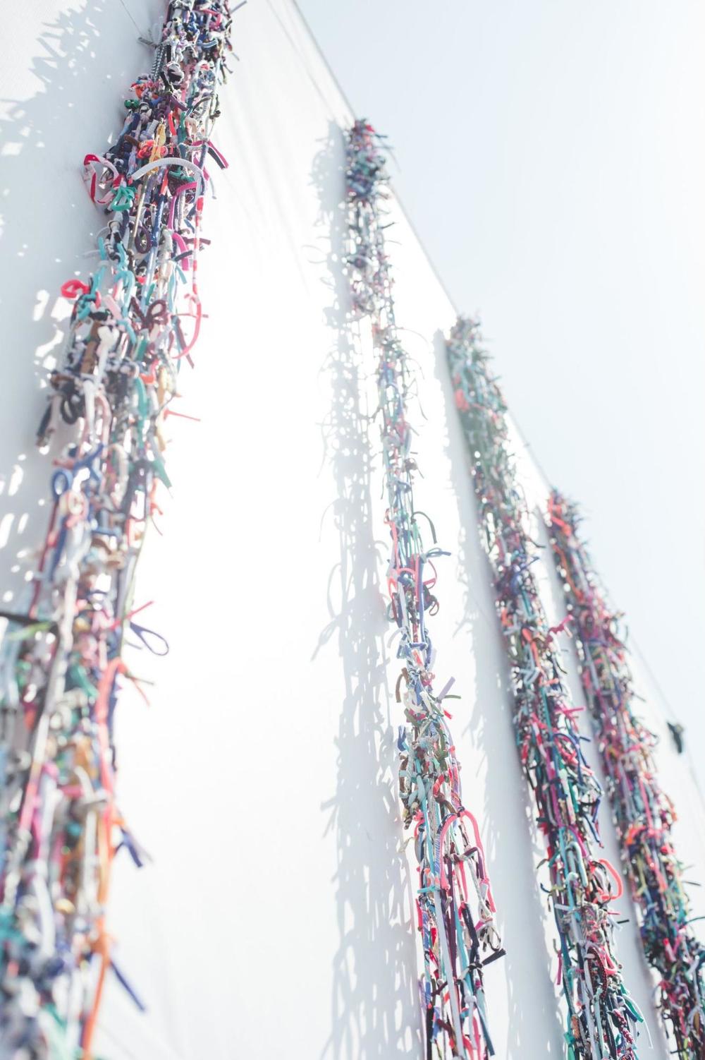 The<em> Border Quipu</em> artwork on display above the AMBOS storefront in San Ysidro, Calif. in view of traffic crossing the border.