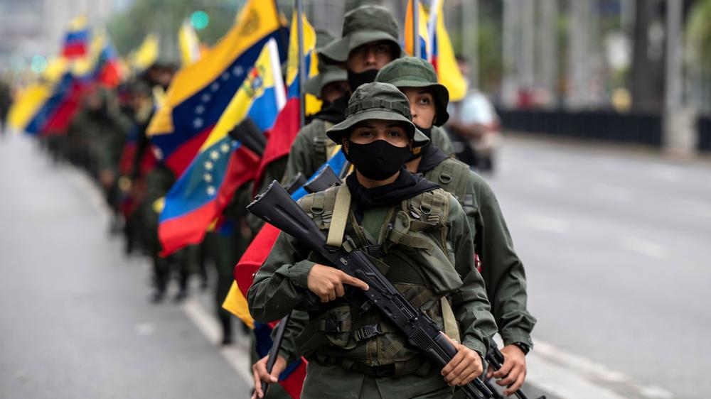 Venezuelan armed service members participate in a military parade in Caracas on March 5.