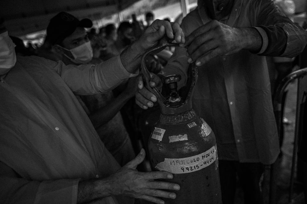 Relatives of coronavirus patients wait for hours since early in the morning to refill their oxygen cylinders at Carboxi, a company that sells oxygen, in Manaus, on Jan. 19, 2021. Manaus, the largest city in the Brazilian Amazon, suffered from a lack of medical oxygen during the second COVID-19 wave in early 2021 in Amazonas.