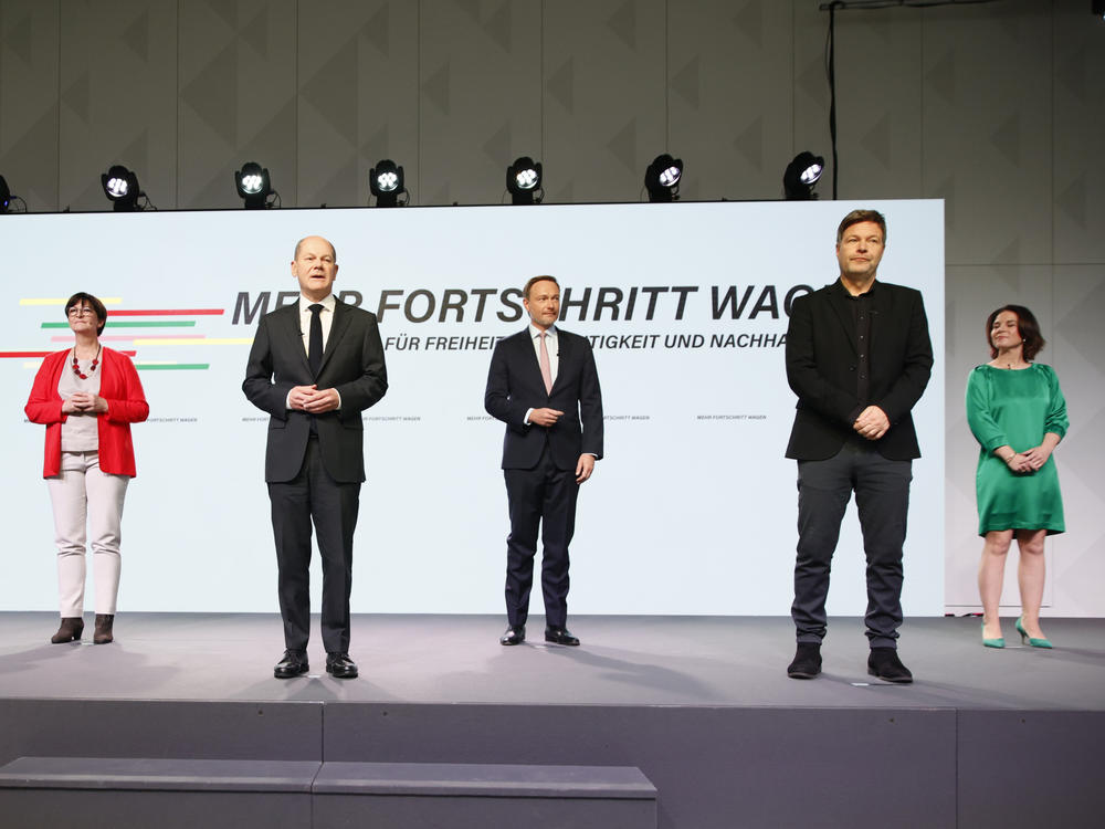 Members of three German parties at the signing of a coalition agreement are (from left) Social Democrats Norbert Walter-Borjan, Saskia Esken and new Chancellor Olaf Scholz, Free Democrat Christian Lindner, and the Green party's Robert Habeck and Annalena Baerbock on Tuesday in Berlin.