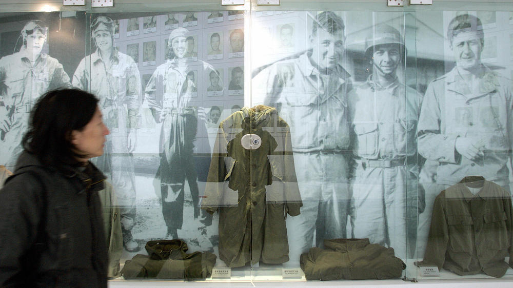 A visitor walks past the images and old uniforms of the Flying Tigers at the Anti-Japanese War Museum in Dayi county in China's Sichuan province in 2005. Museums and memorials in China and the U.S. remember the AVG.