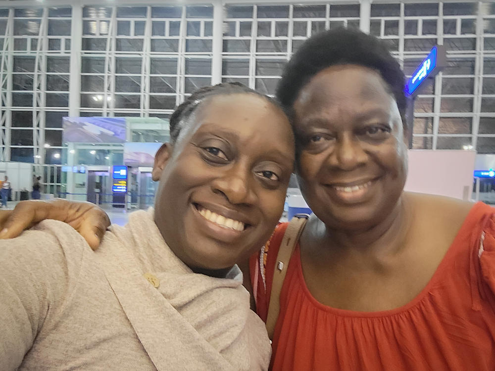 Jacqueline Muna Musiitwa, left, and her mom, Anne Sikwibele, at the airport in Lusaka, Zambia, in November. Musiitwa, who lives in Washington, D.C., is worried that her mom may not be able to visit the U.S. for Christmas. In an effort to stem the spread of the omicron variant, several nations have imposed travel bans on southern African nations, which are in a state of flux.