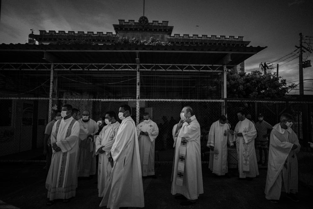 Priests get ready for the celebration of the Immaculate Conception, on Dec. 8, 2020, in Manaus. The celebration was marked by prayers for a better year, hopes for the continuation of health measures to prevent COVID-19 and memories of people who died during the pandemic.