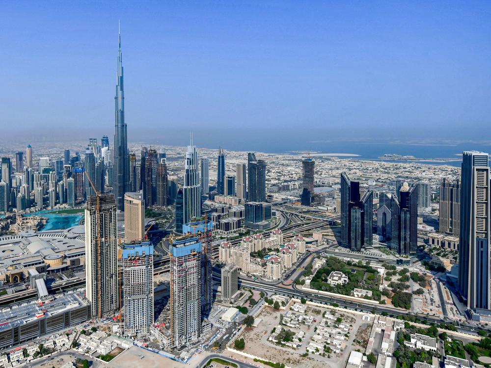 The United Arab Emirates is changing its workweek to have half days on Fridays and a Saturday-Sunday weekend. Here, the country's emirate of Dubai and its Burj Khalifa skyscraper are photographed from a helicopter on July 8, 2020.