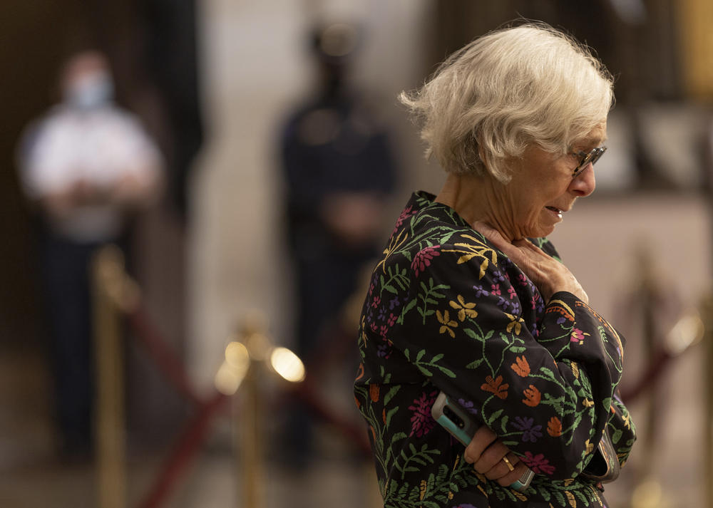 A visitor pays their respects in front of the casket of former Sen. Bob Dole in the rotunda of the U.S. Capitol