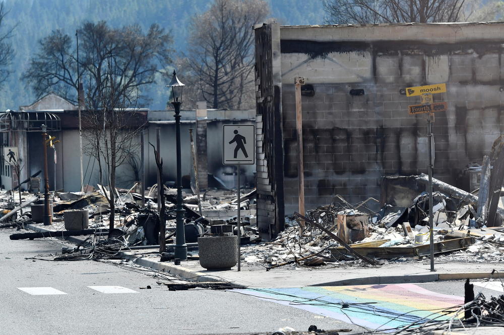The charred remnants of homes and buildings, destroyed by a wildfire on June 30, are seen during a media tour by authorities in Lytton, British Columbia, on July 9.