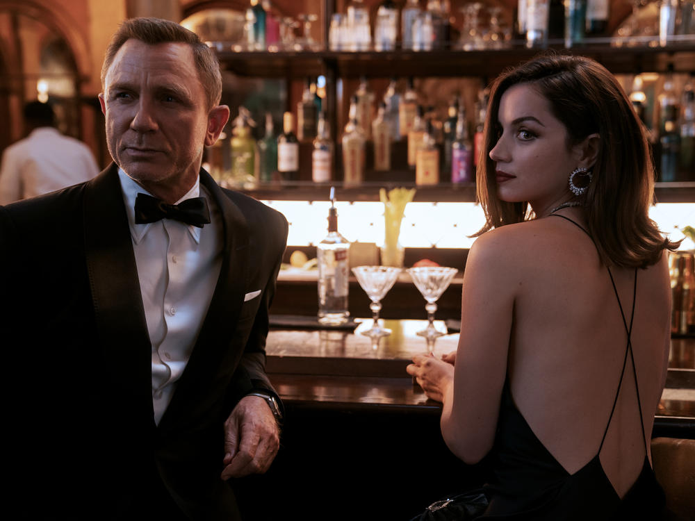 Bond (Daniel Craig) teams up with secret agent Paloma (Ana de Armas) in Havana in <em>No Time to Die.</em>