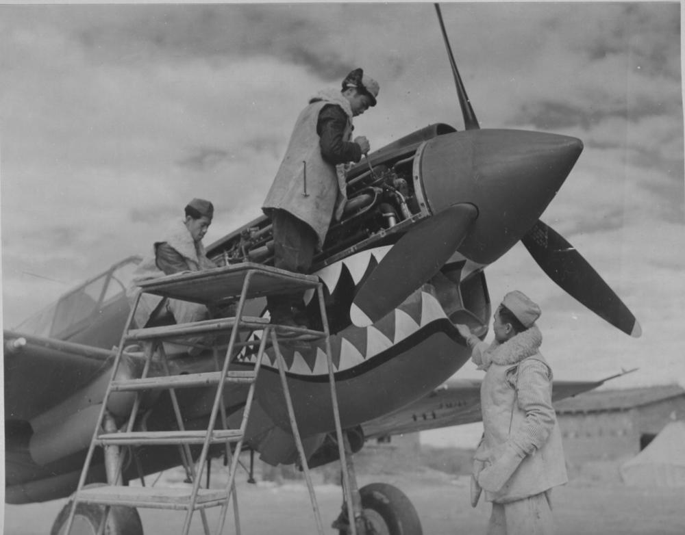 Pak On Lee of Portland, Ore., George Lum of New York City, and Kee Jeung Pon of New York City were among the Chinese American mechanics who served in the AVG. Here they are pictured in Kunming, China, in November 1942 working on a Curtiss P-40 of the 23d Fighter Group, which evolved from the AVG.