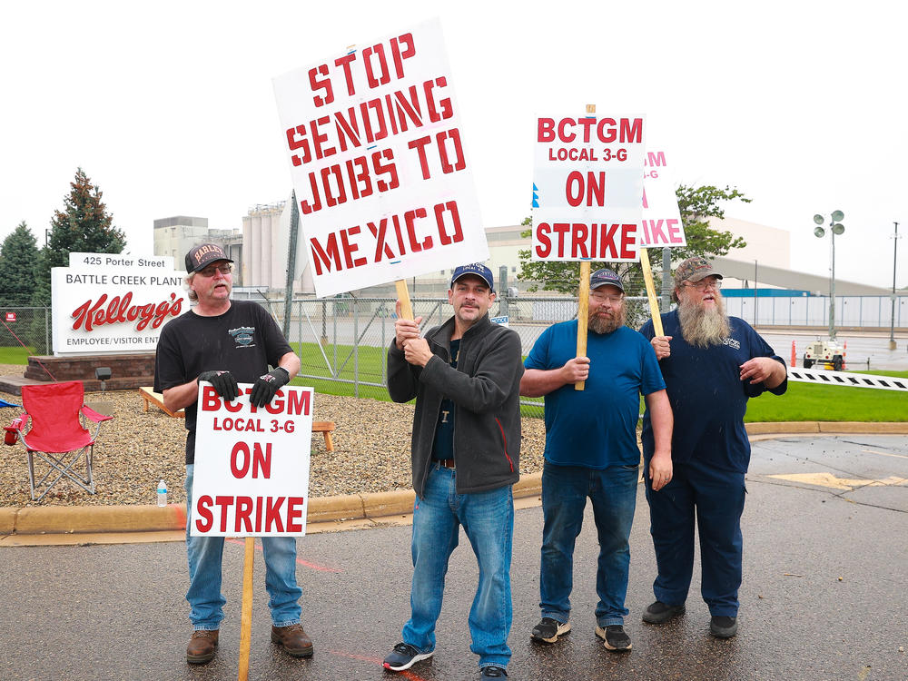 Kellogg's Cereal plant workers demonstrate in front of the Kellogg's Cereal Plant on Oct. 7, 2021 in Battle Creek, Mich. Workers at Kellogg's cereal plants are striking over the loss of premium health care, holiday and vacation pay, and reduced retirement benefits.