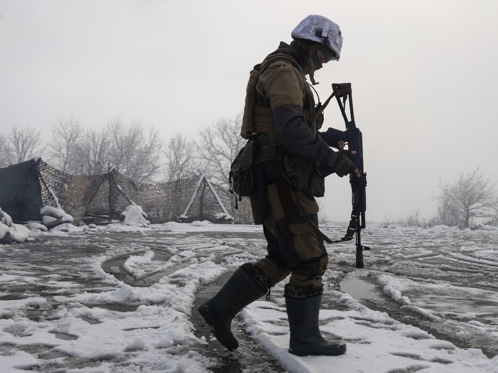 A Ukrainian soldier walks at the line of separation from pro-Russian rebels near Popasna, Donetsk region, Ukraine, on Tuesday.