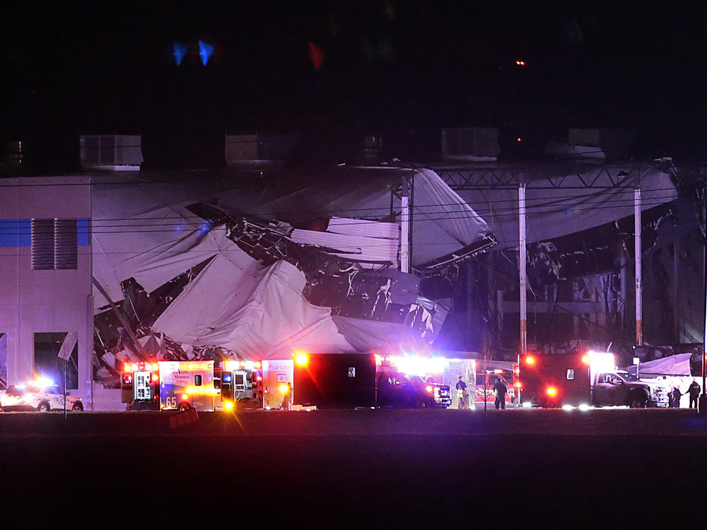 The roof of an Amazon distribution center is partially collapsed after being hit by an apparent tornado on Friday, Dec. 10, 2021 in Edwardsville, Ill.