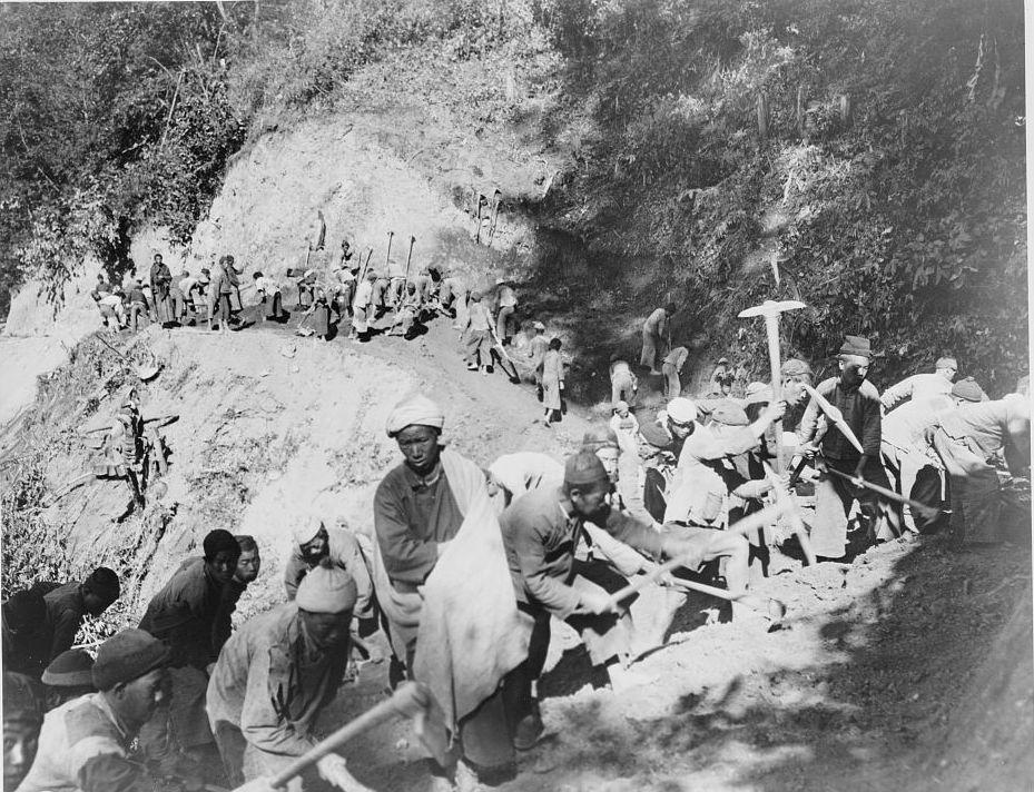 Chinese laborers working to repair the Burma Road in southwest China, circa 1944. During World War II, this long windy road from Burma through the mountains was essential to keeping China supplied.