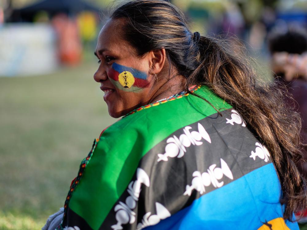 An independence supporter with a flag of the Socialist Kanak National Liberation Front (FLNKS) on October 1, 2020.