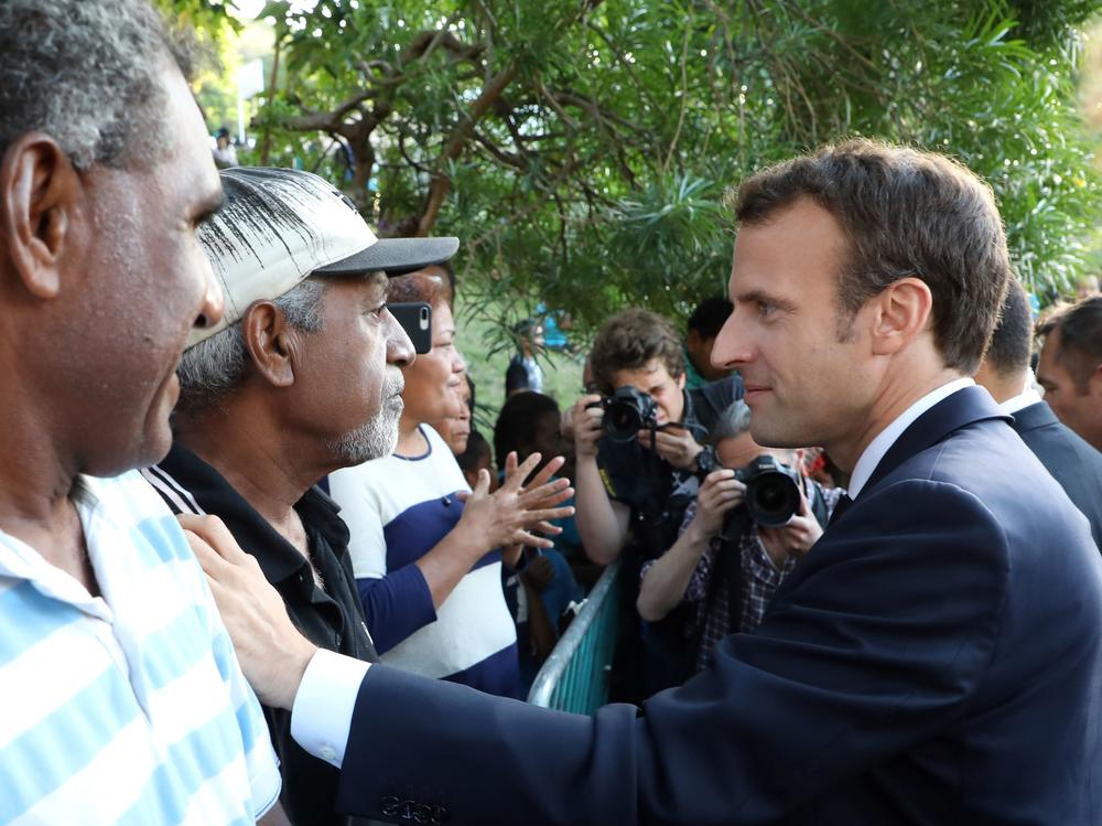 French President Emmanuel Macron meets residents of the Pierre Lenquette residential area on May 4, 2018.