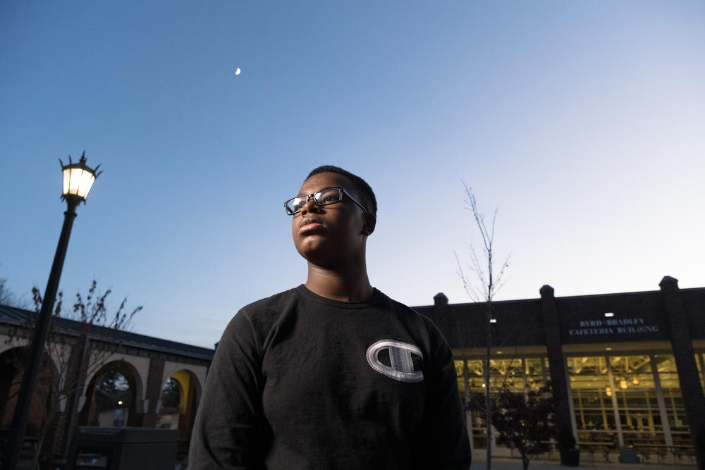 Sophomore Dreshon Robinson stands outside his high school cafeteria, where the learning hub takes place. He wants to go to college and be an audio engineer.