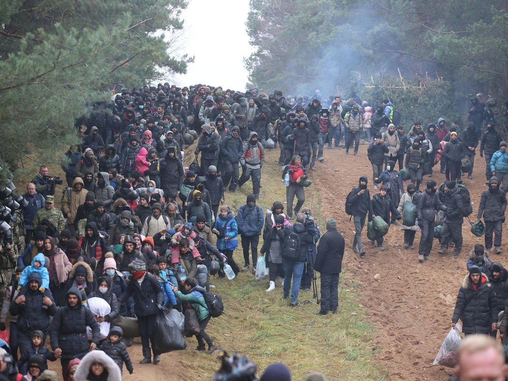 Migrants head toward a border checkpoint on the Belarusian-Polish border on Nov. 15. U.S. officials have accused Belarusian leader Alexander Lukashenko of taking advantage of desperate migrants.