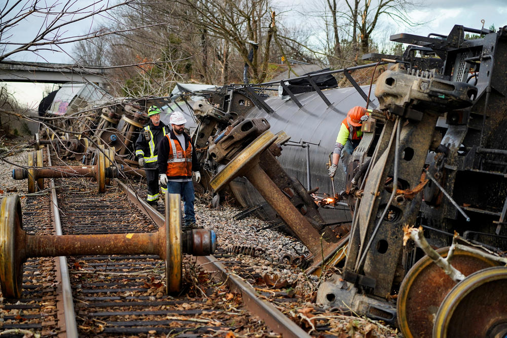 <strong>Sat., Dec. 11: </strong>People work at the scene of a train derailment after a devastating outbreak of tornadoes in Earlington, Ky.