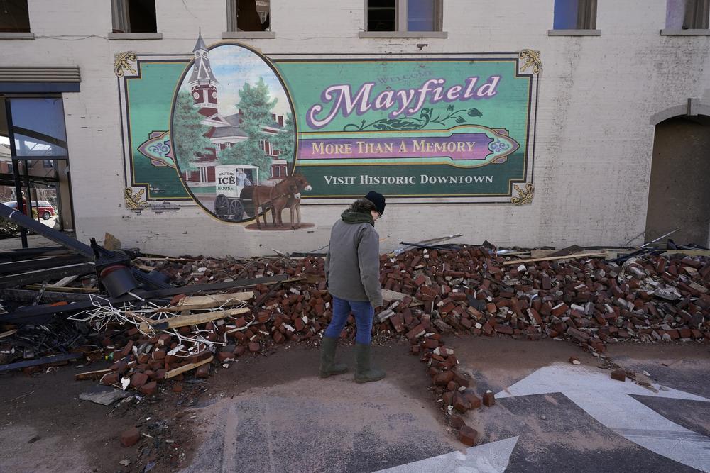 <strong>Sat., Dec. 11: </strong>Damage from a tornado is seen in downtown Mayfield, Ky.