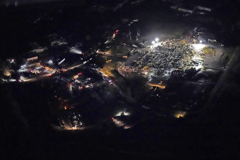 <strong>Sat., Dec. 11: </strong>In this aerial photo, a collapsed factory is seen with workers searching for survivors in Mayfield, Ky., after tornadoes came through the area the previous night.